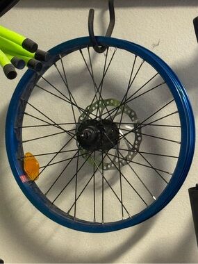 Blue Bicycle Wheel Rim with Black Spokes and Reflector - Brand Unspecified
